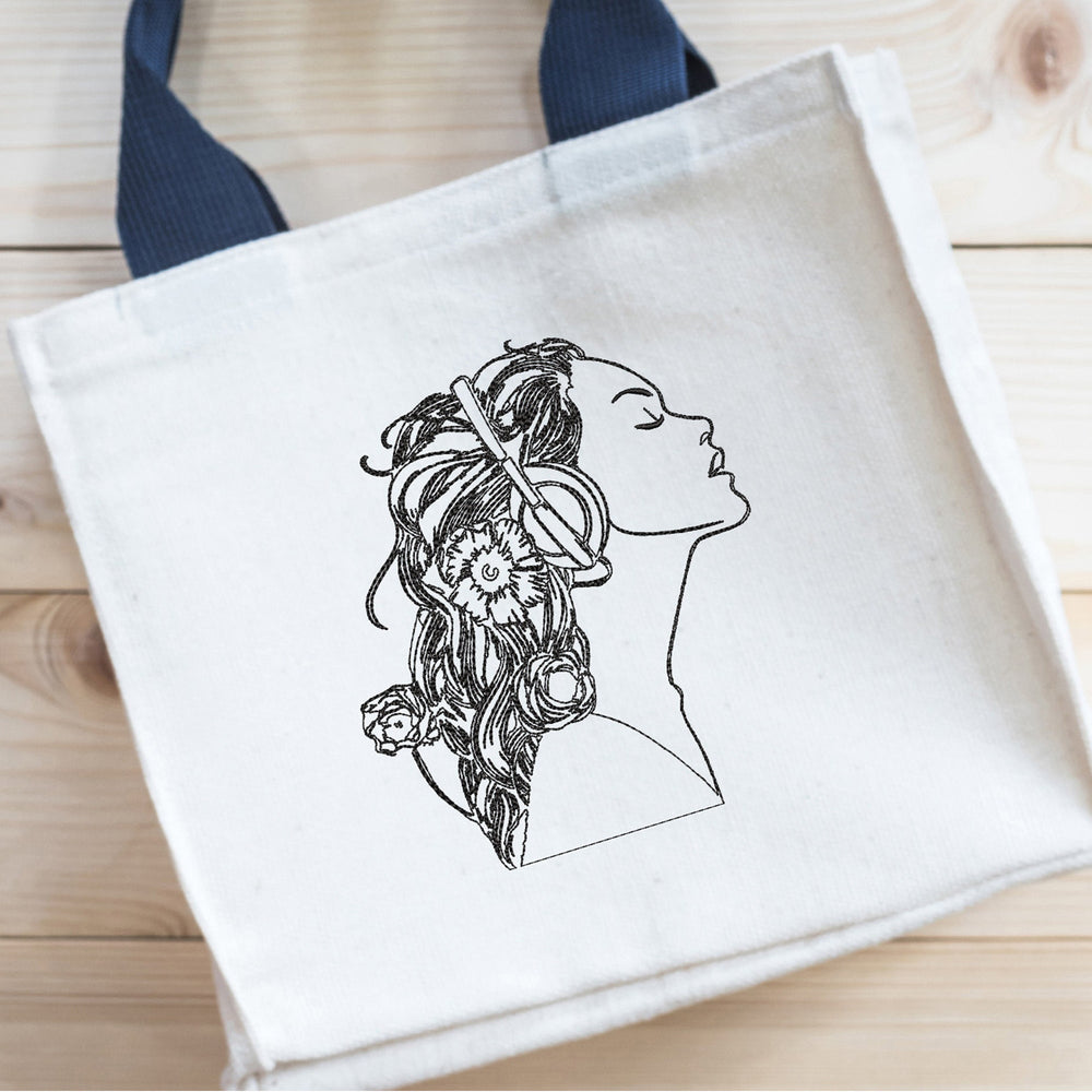 girls embroidery design stitched as a woman face line art on a tote bag