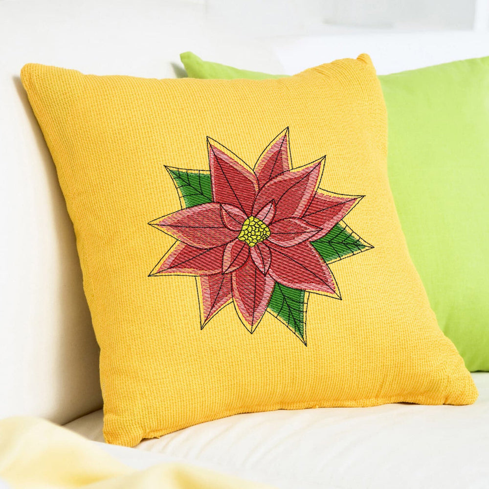 christmas embroidery design stitched as a red poinsettia flower on a yellow pillow