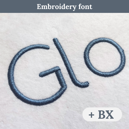 Close-up of embroidered lettering on a light fabric surface, showing the word 'Glo' in a blue-gray satin-like thread. A dark gray banner at the top reads 'Embroidery font,' and a white badge at bottom right says '+ BX.