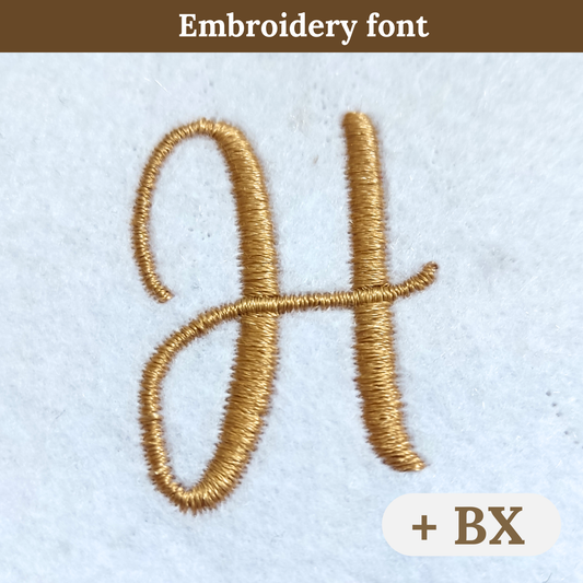 A close-up of an embroidered letter H in a gold thread font on a light textured fabric background, with a brown banner reading 'Embroidery font' at the top and a white badge at bottom right reading '+ BX'.