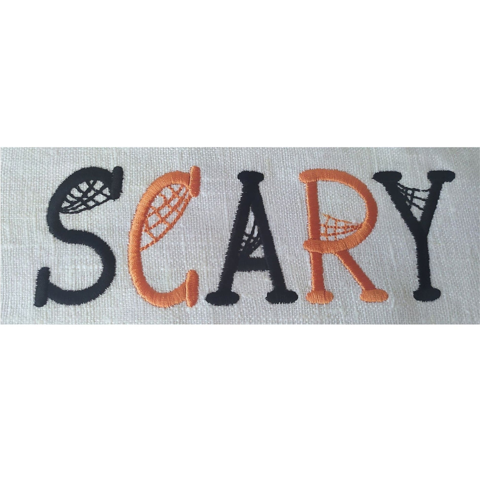Embroidered word 'SCARY' with decorative letters on a white background